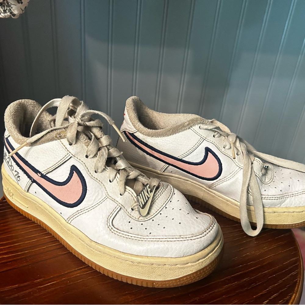 Nike Air Force 1 White Leather Sneakers with Pink Swoosh
